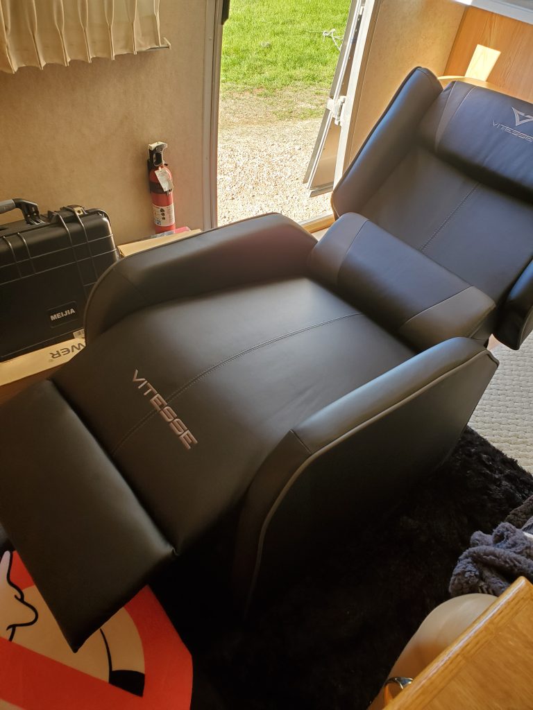 The faux leather VITESSE Gaming Recliner Chair fits perfectly into the space of my Airstream trailer's living room and is very comfortable to recline in. I spend several hours a day working on my laptop while sitting in it .