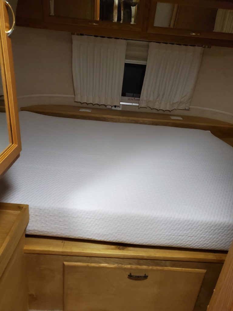 My custom cabinet bed in my Airstream with a queen sized Tuft and Needle memory foam mattresses