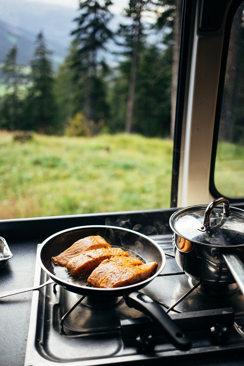 A camp stove will make cooking inside your camper van much easier and help keep your food budget manageable. 