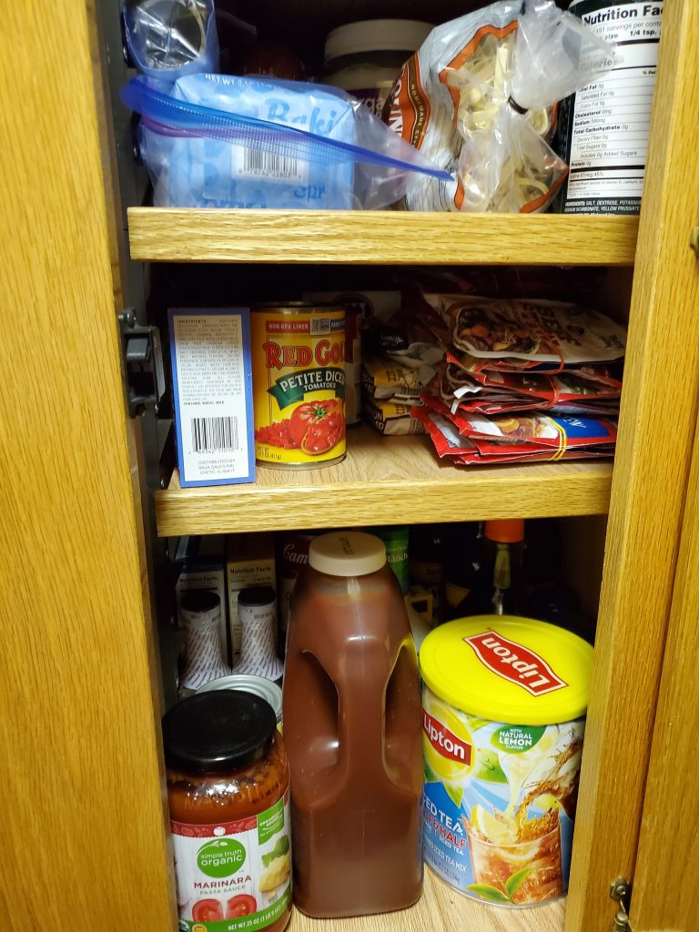 Rubber bands tie several packages of gravy and sauce mix together., allowing for more cabinet space.